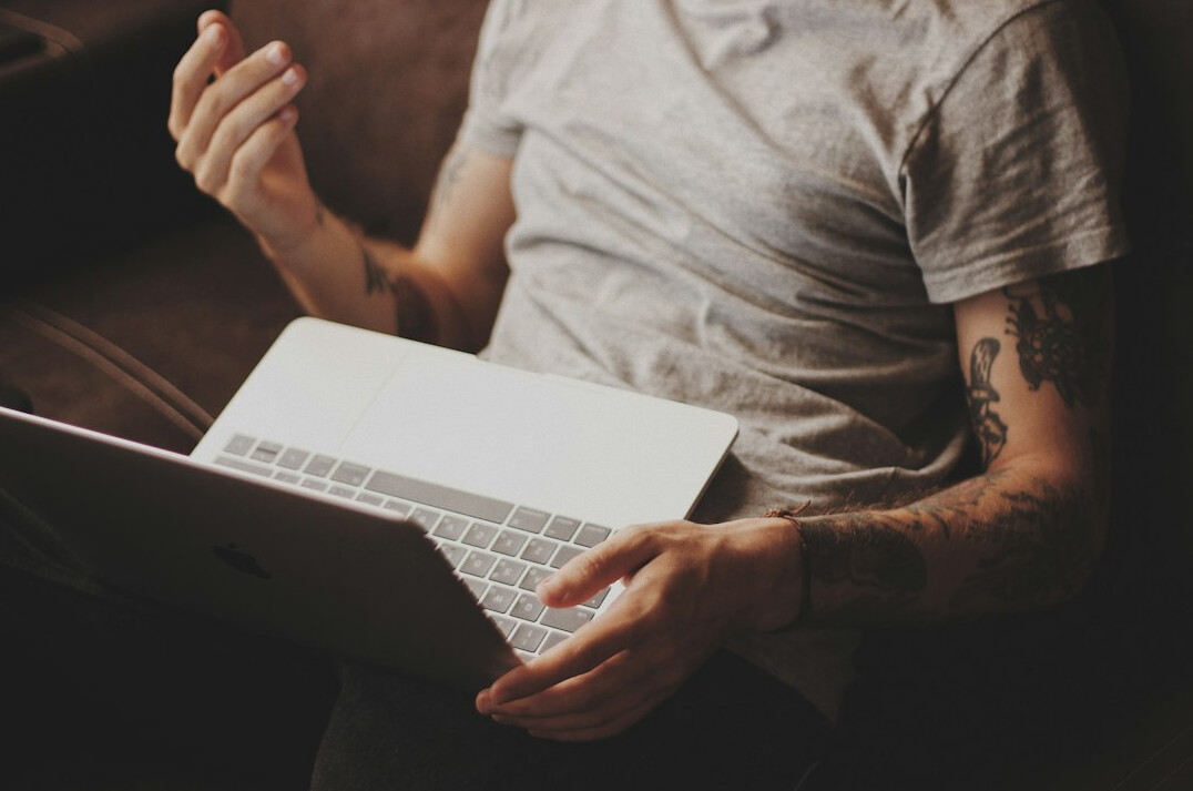 person reading blog on laptop