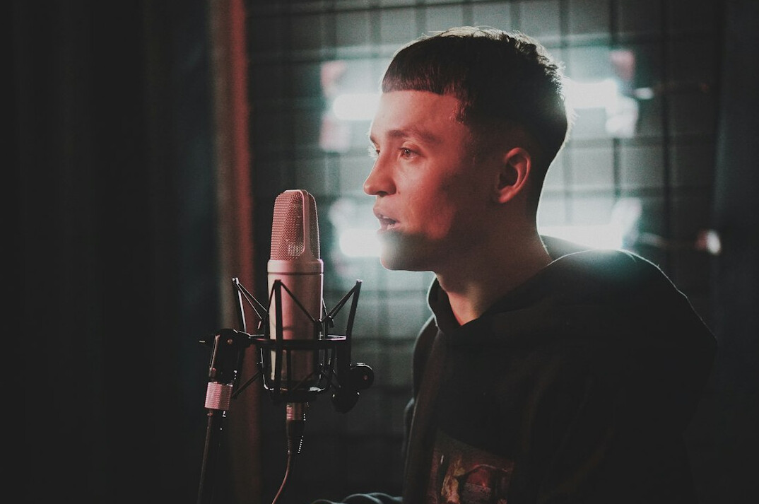 person speaking into microphone